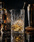 Clear botanical-pattern cocktail mixing glass with pour spout
