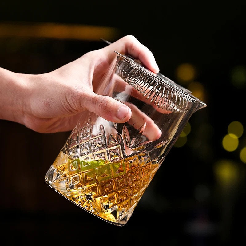 Faceted cocktail mixing glass side view